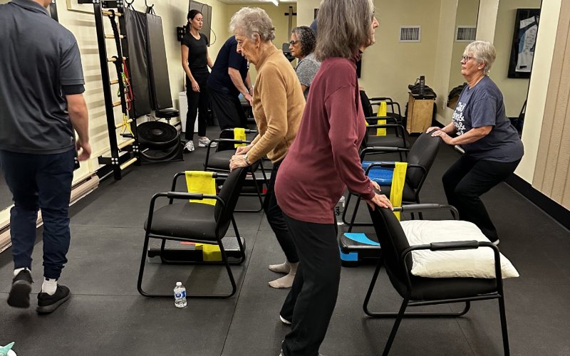Senior adults participating in group fitness class at Oshawa wellness centre arthritis program